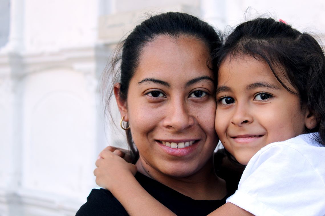 A mother and daughter hug