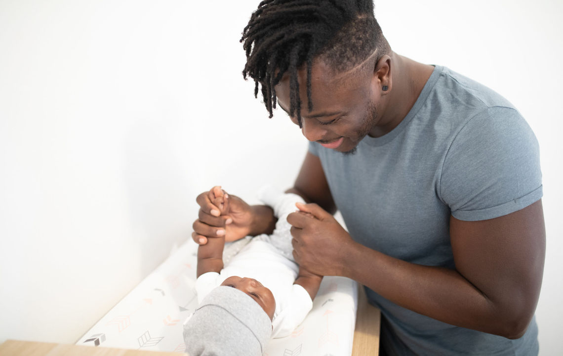 A father plays with his baby.