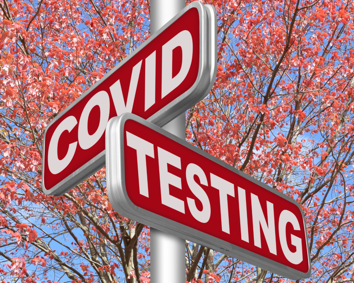 A sign reads "COVID testing."