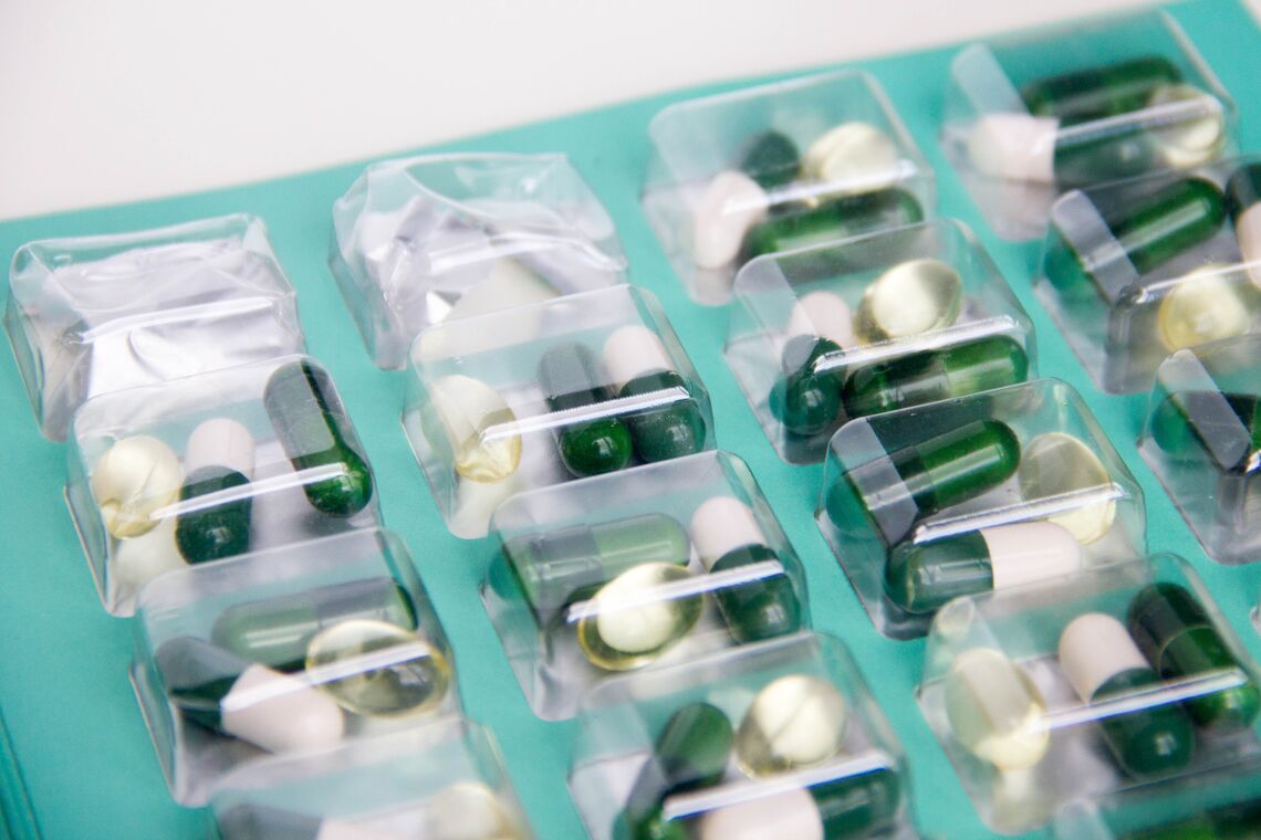Green and white prescription drug pills