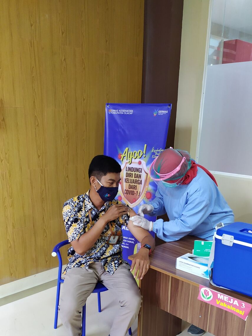 A man receives a COVID-19 vaccine