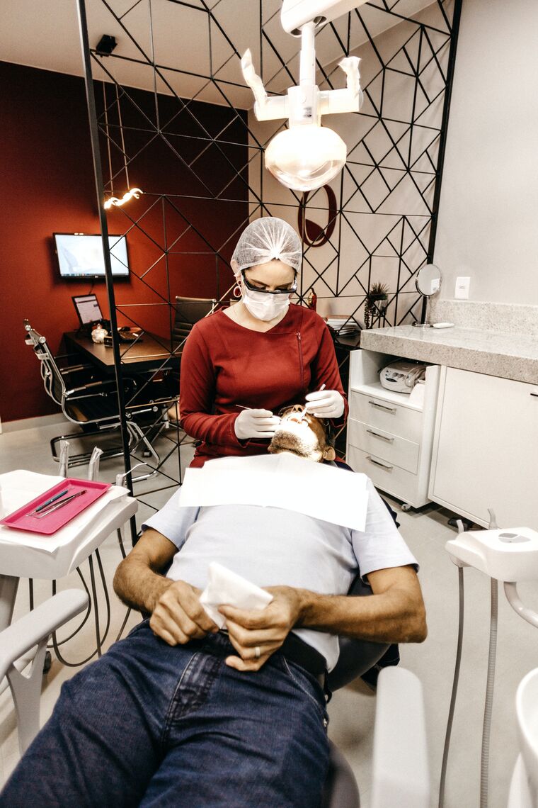 A man is treated in a dentist's office.