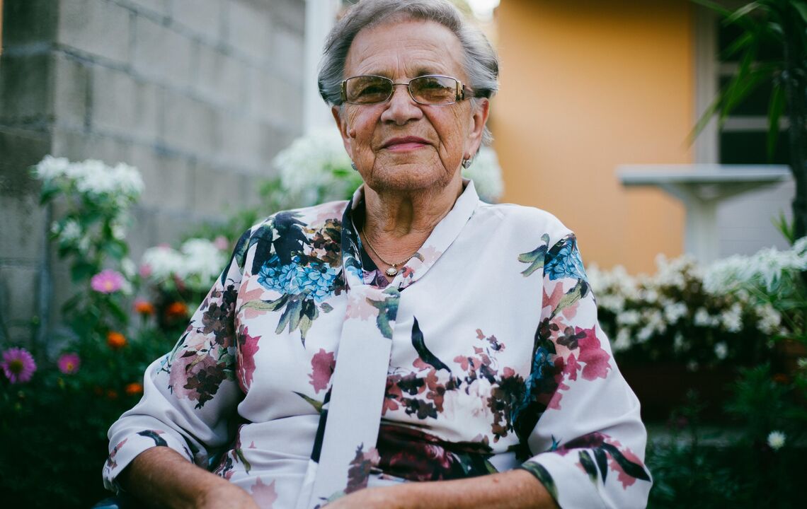 Portrait of an elderly lady, who looks directly into the camera