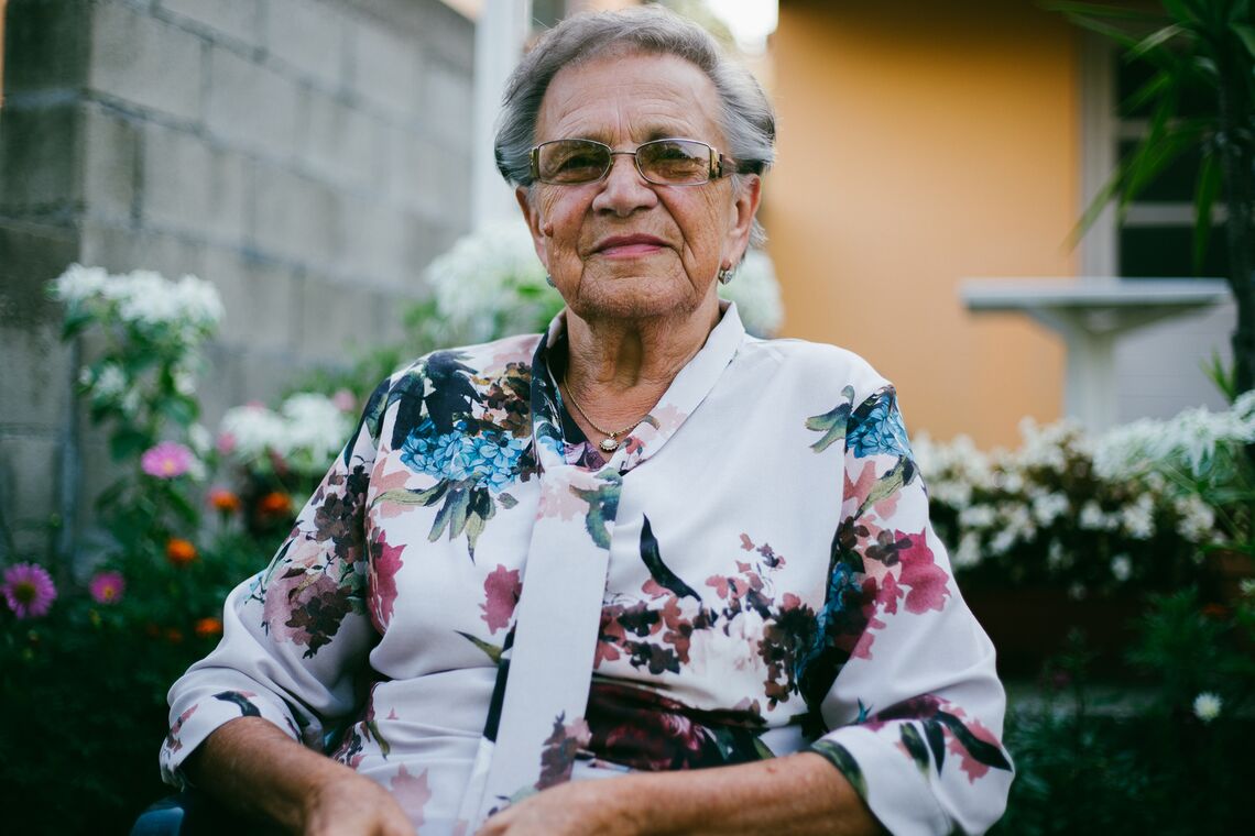 Portrait of an elderly lady, who looks directly into the camera